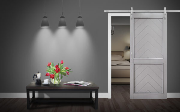 Close up of closed wooden door in the empty room with copy space