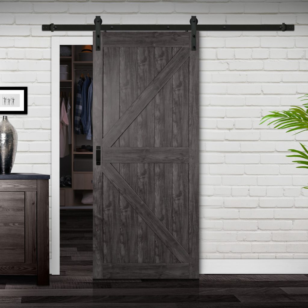 Close up of closed wooden door in the empty room with copy space Close up of closed wooden door in the empty room with copy space