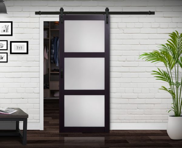 Close up of closed wooden door in the empty room with copy space