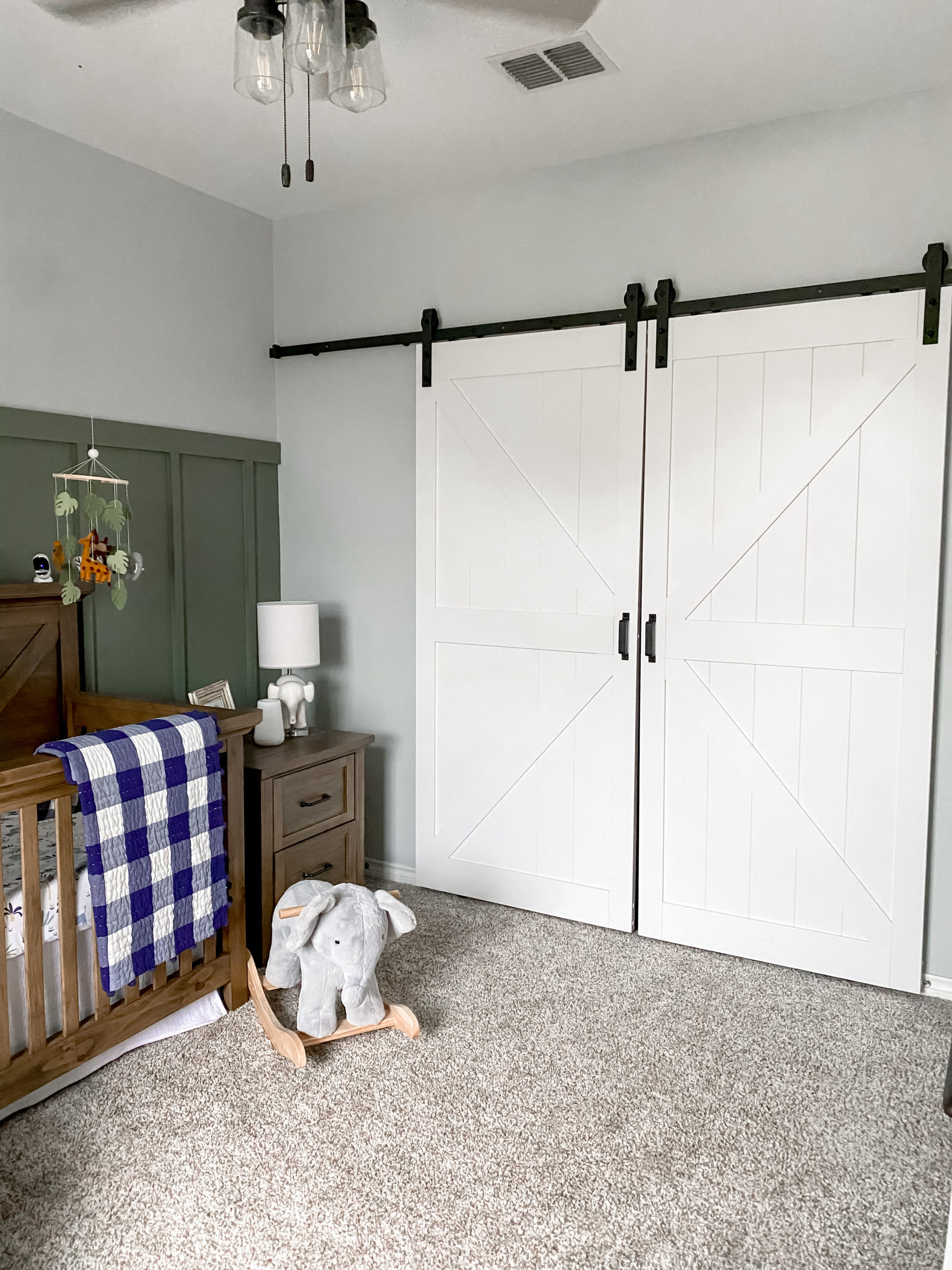 Jungle Themed Nursery by Makenna (@somutschlove on Instagram) Featuring Our Easy Build Stone K-Design Biparting White Barn Doors